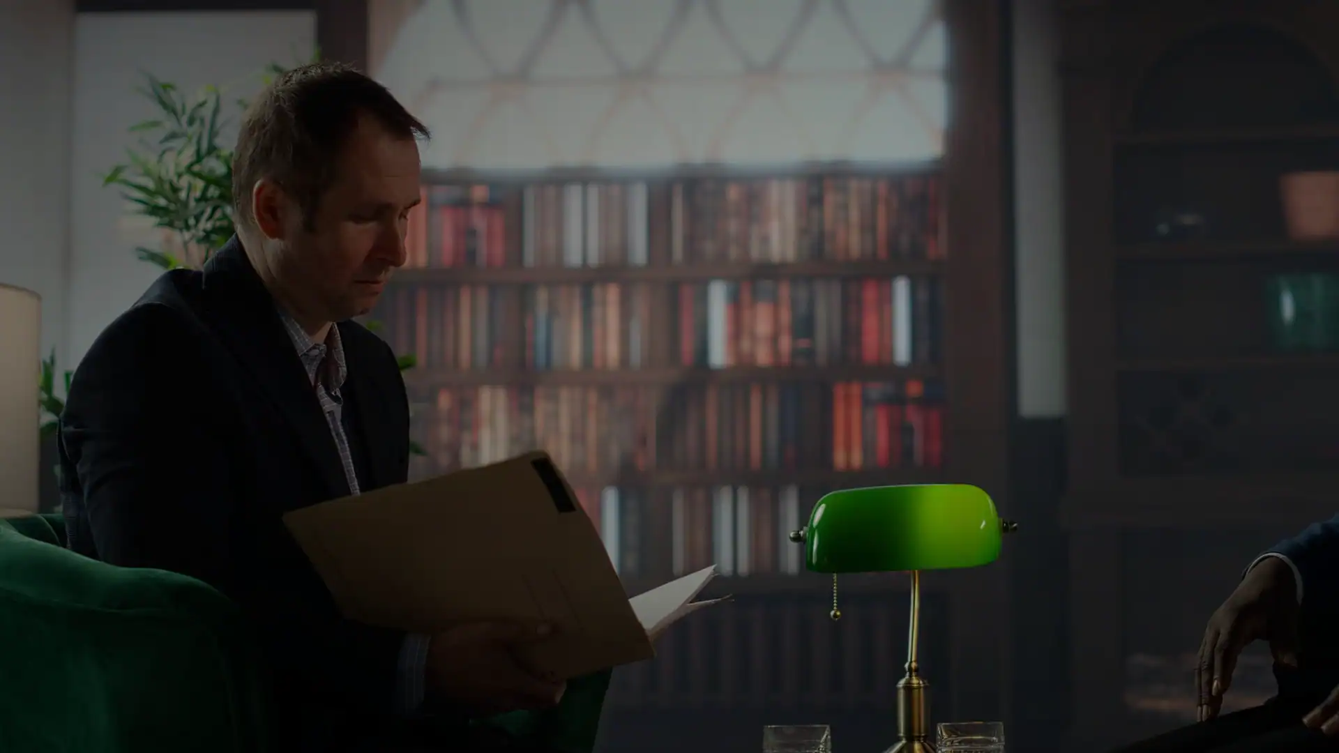 Team of intelligence agents reviewing critical documents in a vintage safe